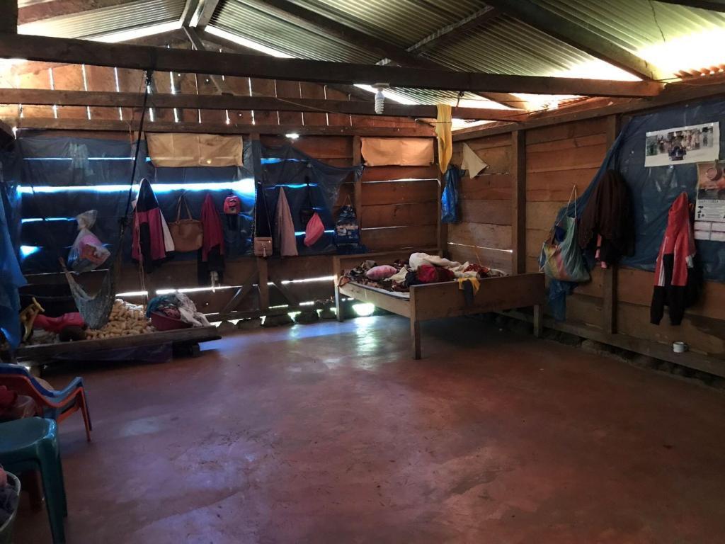 Pictured: The improved house infrastructure seen here has improved the life of the family living here. Their new concrete floor and stove remove the source of illness for their children.
